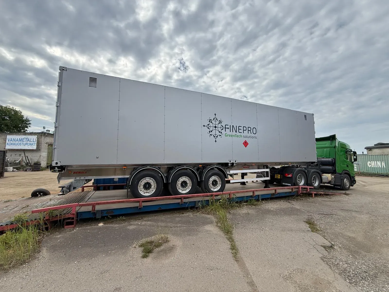 A 40 ft HC CNG transport container and trailer positioned on a weighbridge
